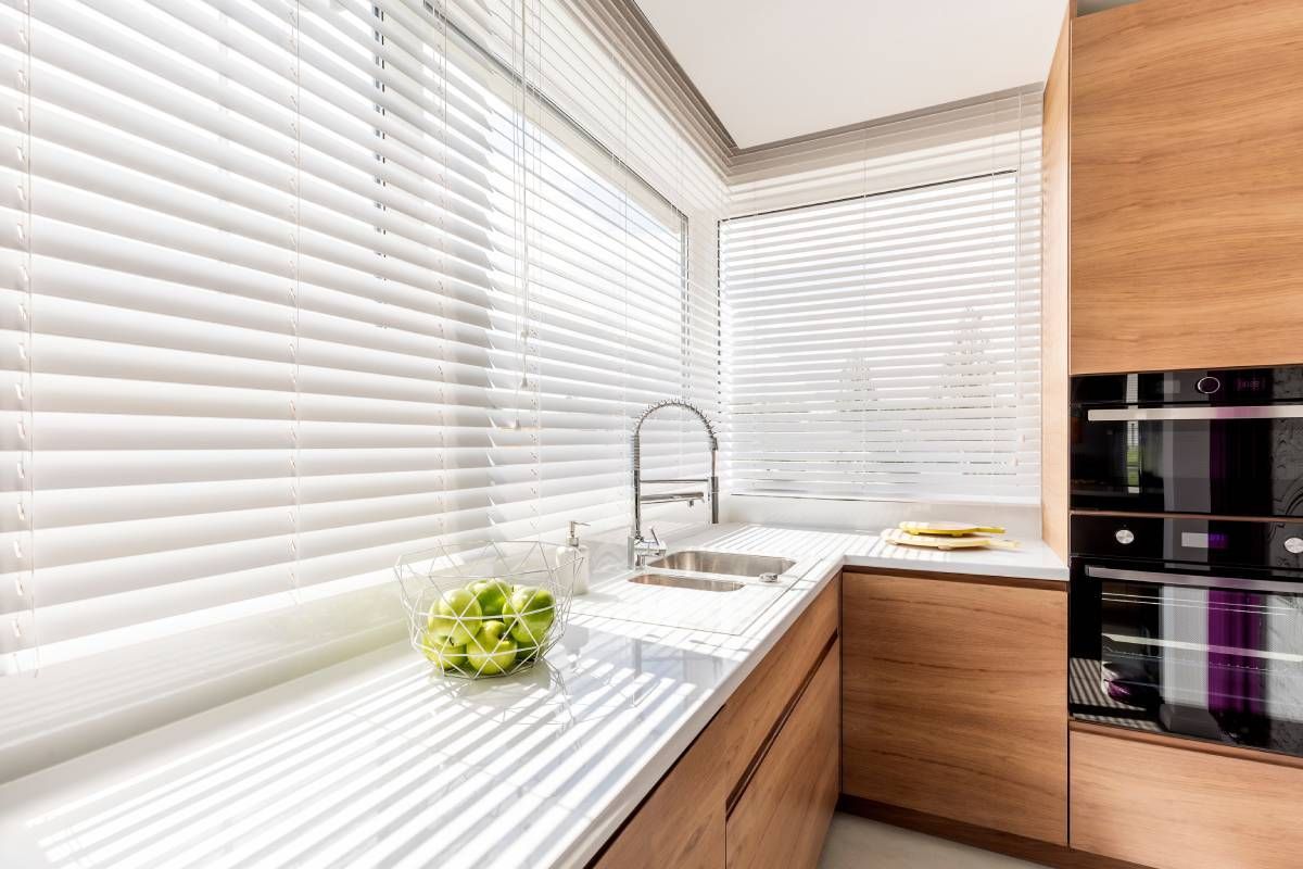 Modern kitchen featuring white kitchen blinds near St. Louis Park, MN