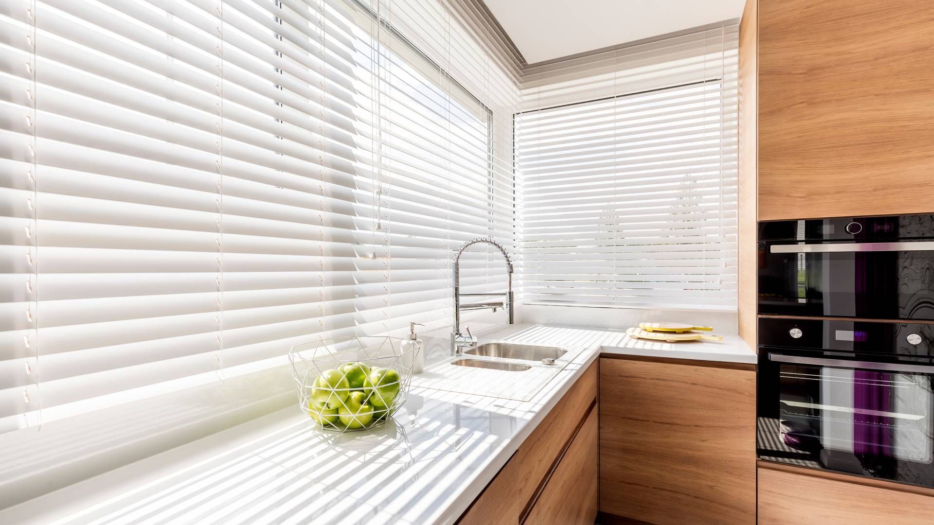 Modern kitchen featuring white kitchen blinds near St. Louis Park, MN