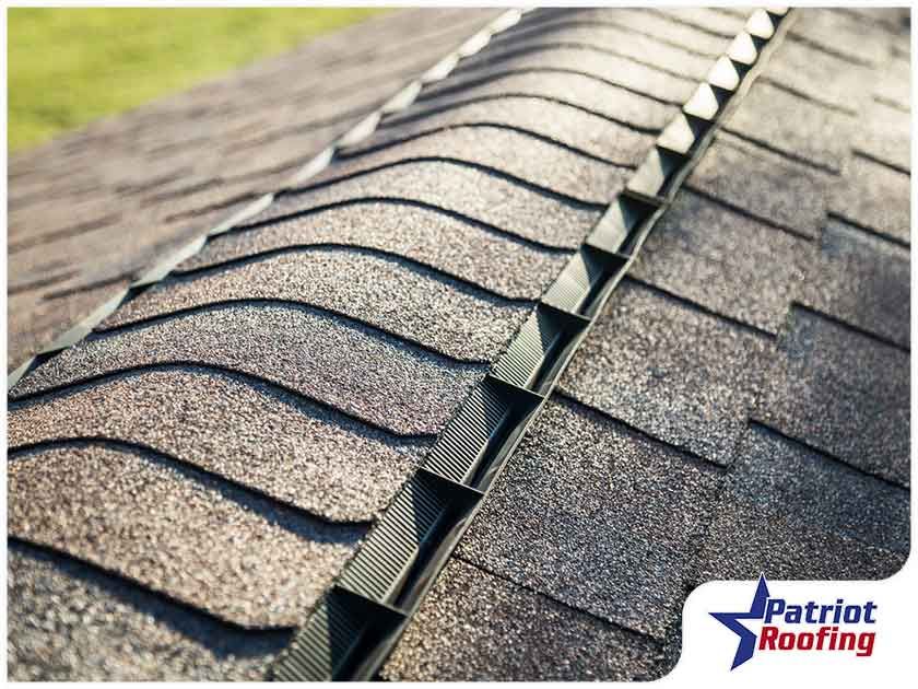 A close up of a roof with the words patriot roofing on the bottom