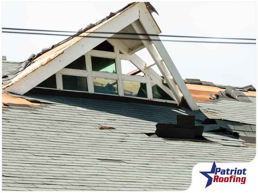 A picture of a roof that has been damaged by a storm.