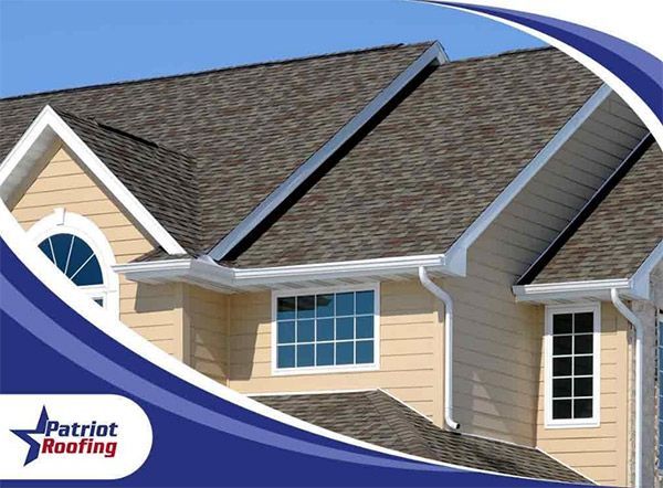 A patriotic roofing ad with a house in the background