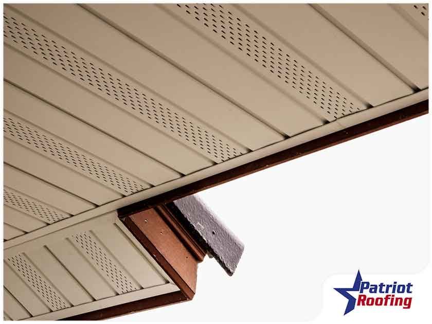 A picture of a roof with patriot roofing written on it