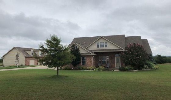 A large house with a tree in front of it