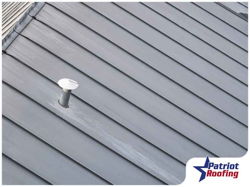 A picture of a roof with the words patriot roofing in the corner