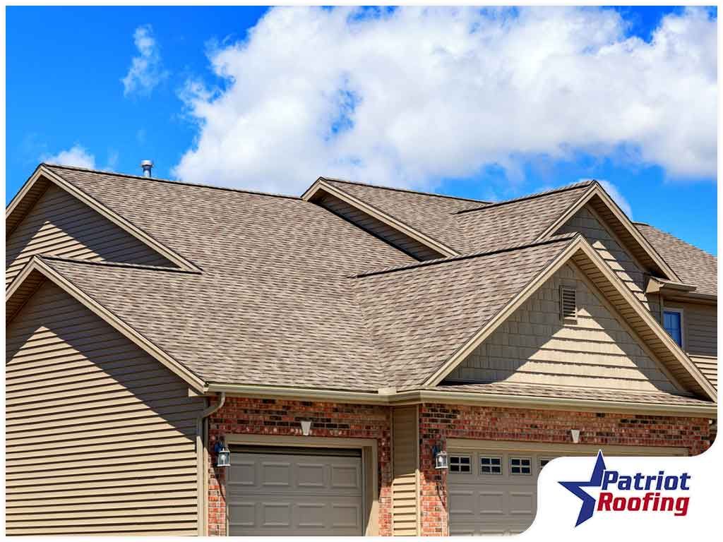 A large house with a roof that is covered in shingles.
