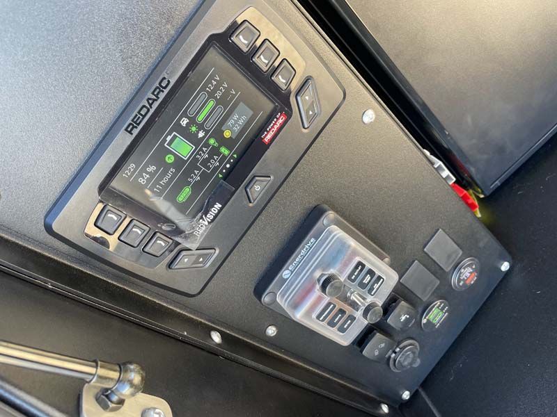 A black panel with a redarc device on it