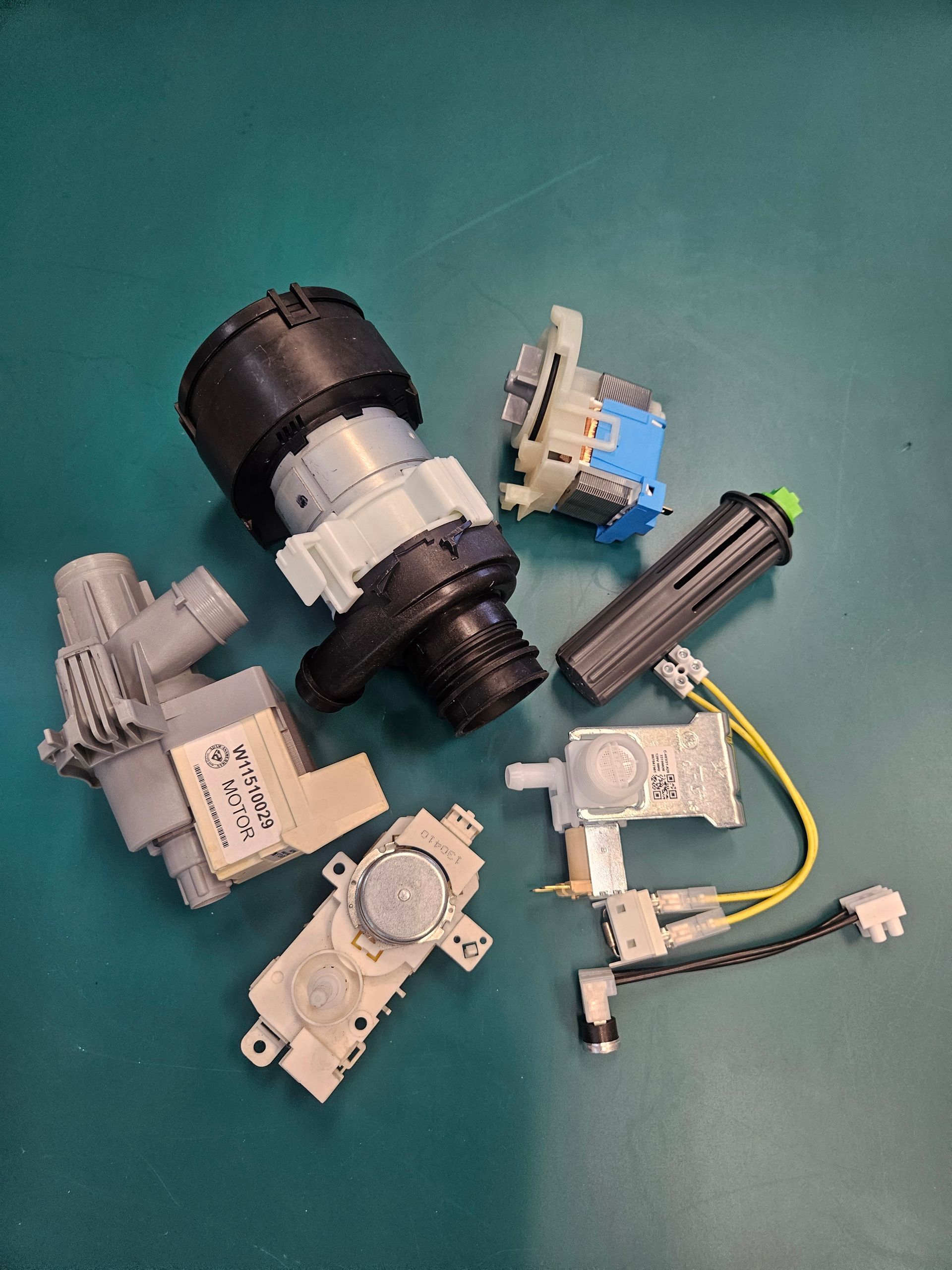 A man is fixing an air conditioner with a multimeter.