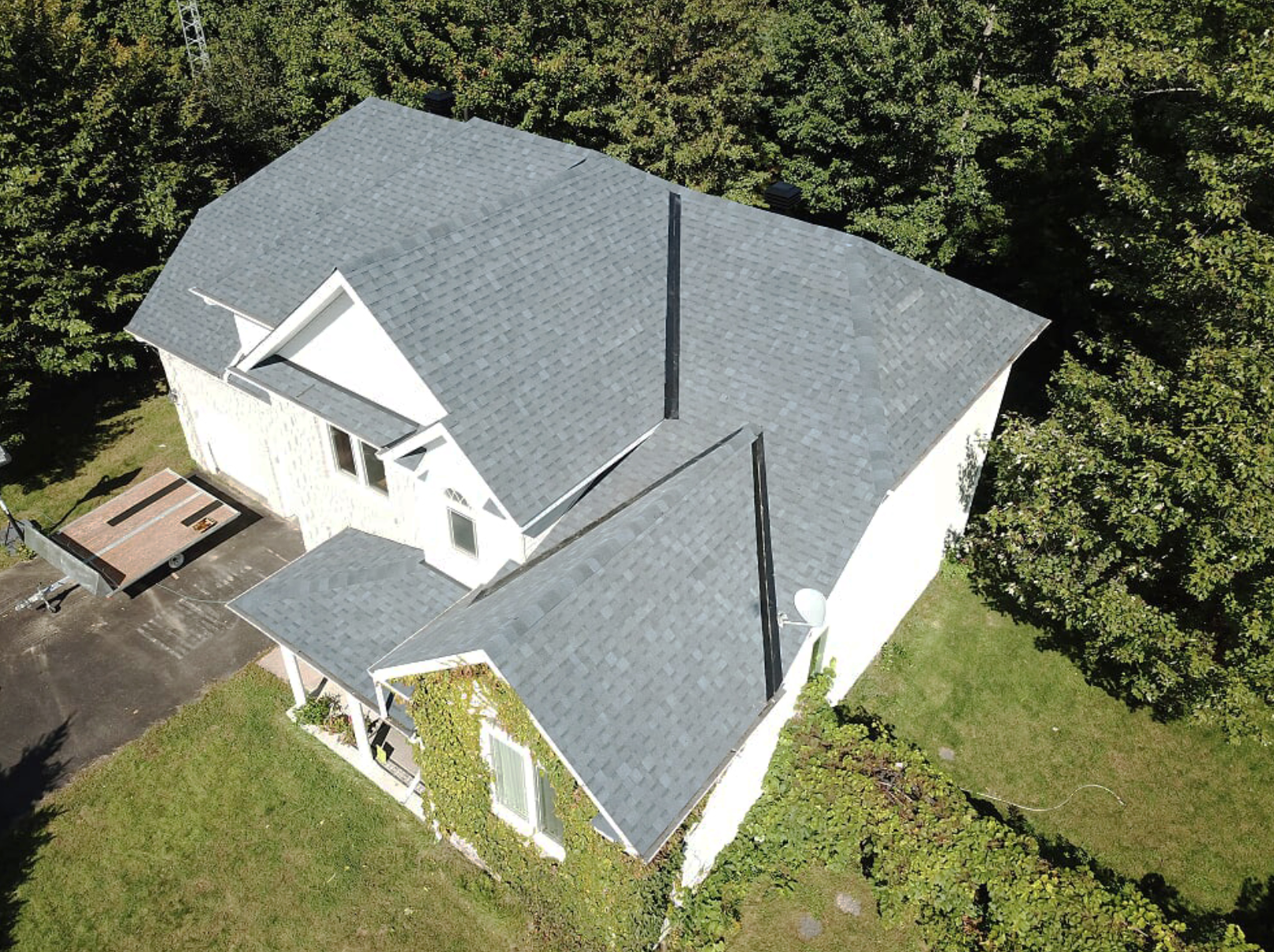 large white building with grey roofing