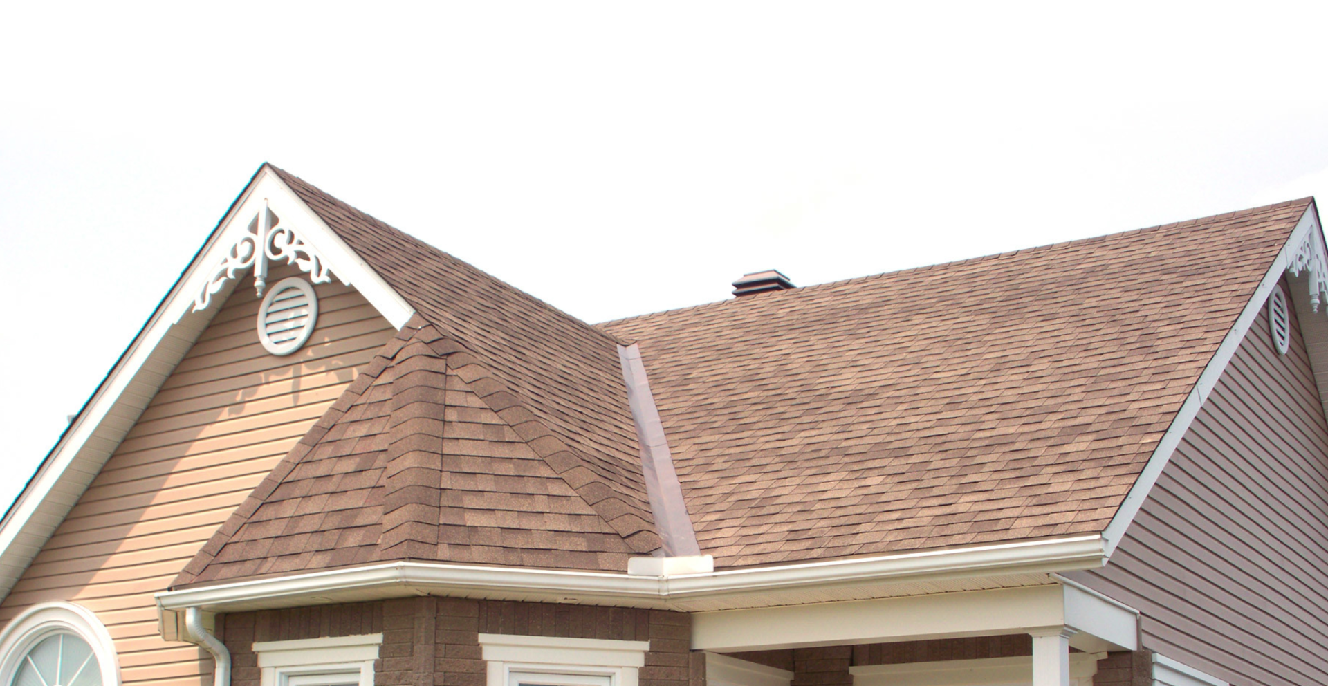 beige house with brown Gable and valler roof