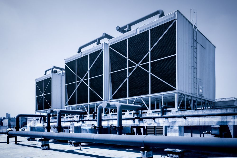 A large building with a lot of pipes coming out of it.