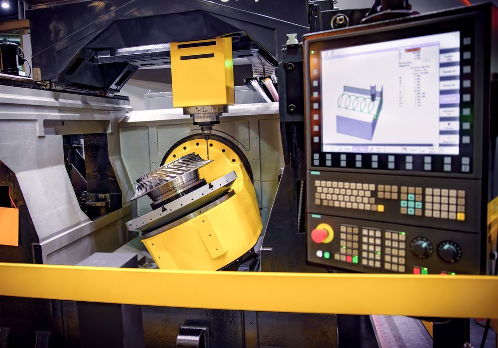 A machine is being operated by a computer.