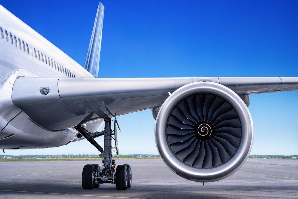 A large passenger jet is parked on a runway.