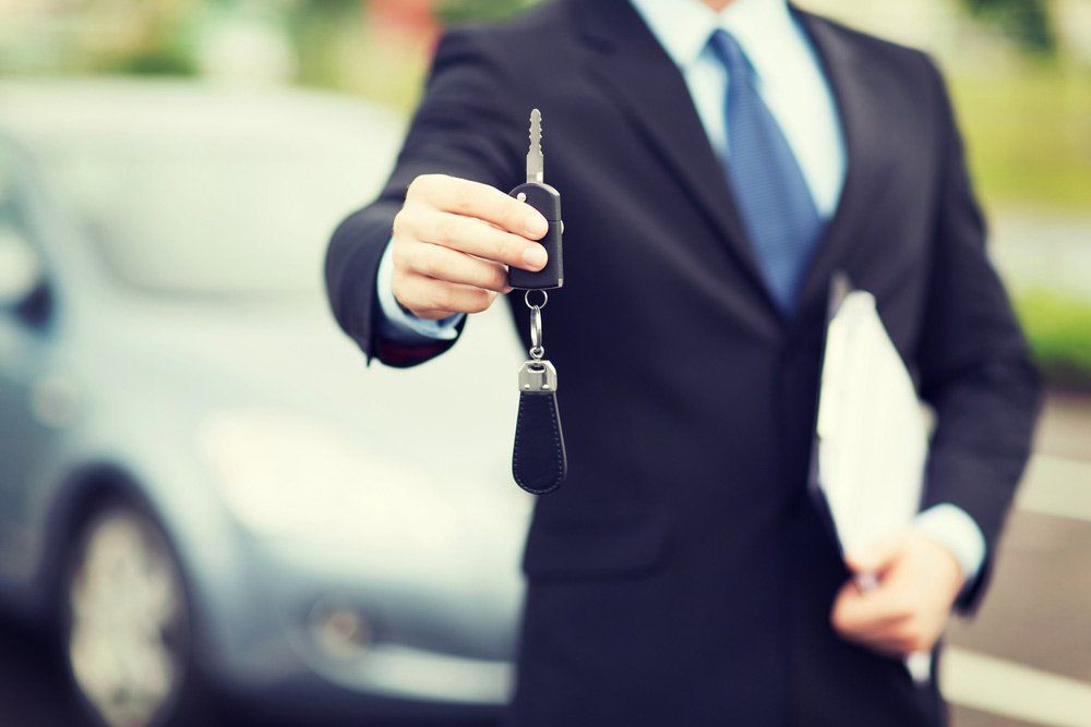 Man Giving Car Keys — Finance Lease in Unanderra, NSW