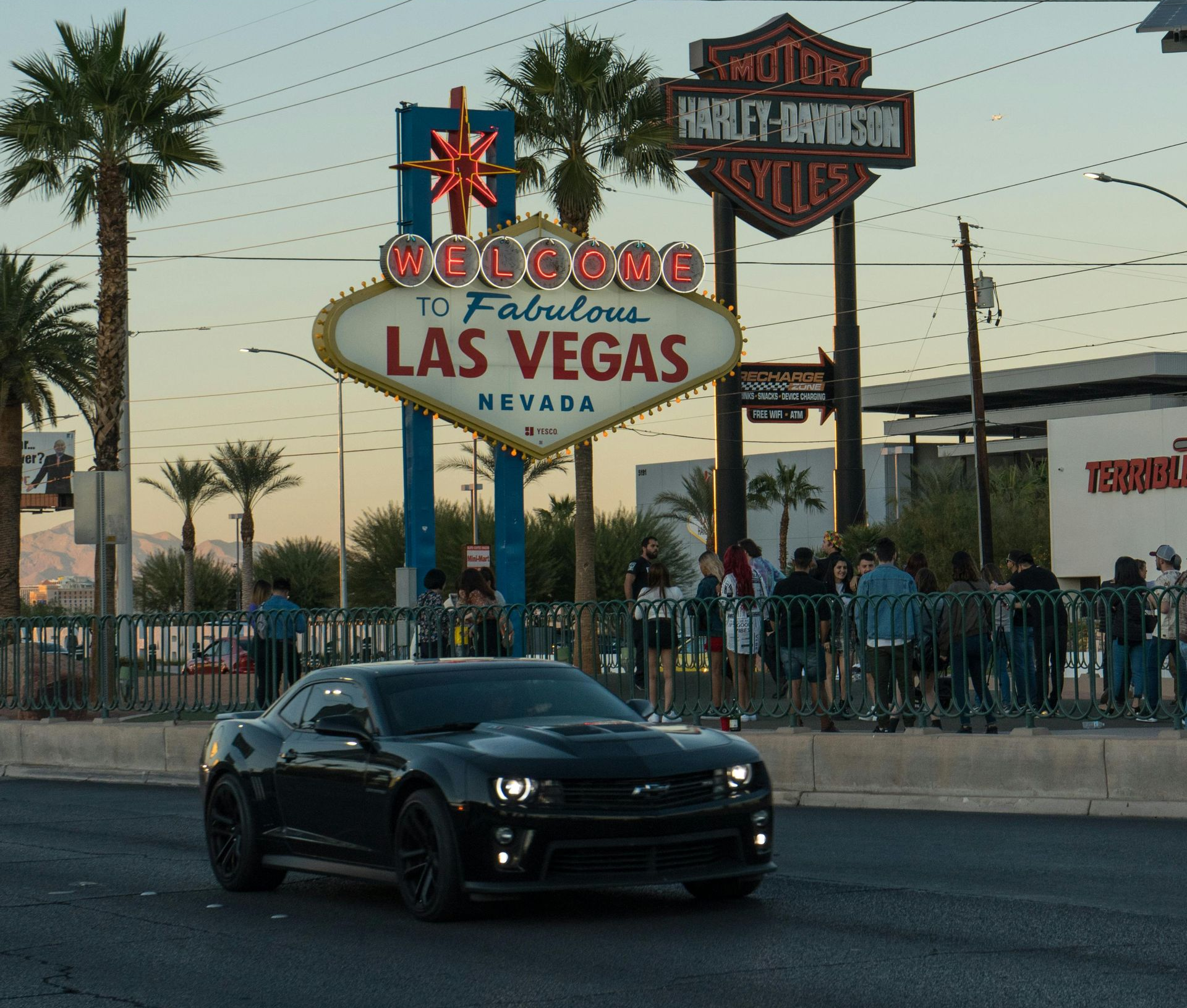 Black sports car in front of the 