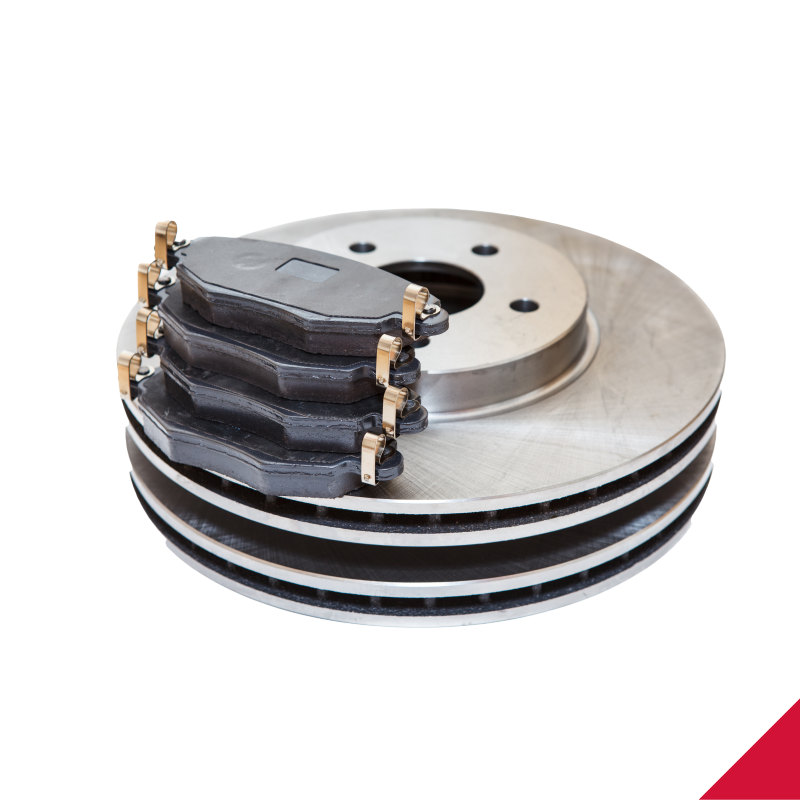 A stack of brake pads and rotors on a white background.