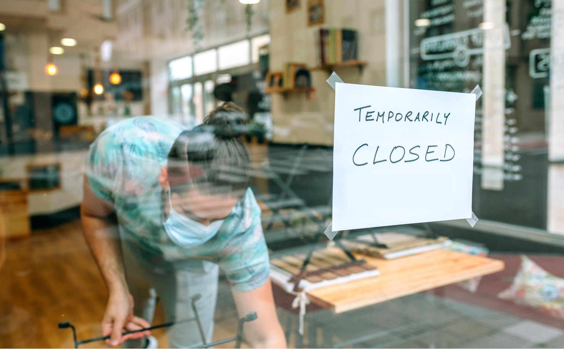 A sandy path leading to the ocean on a sunny day.