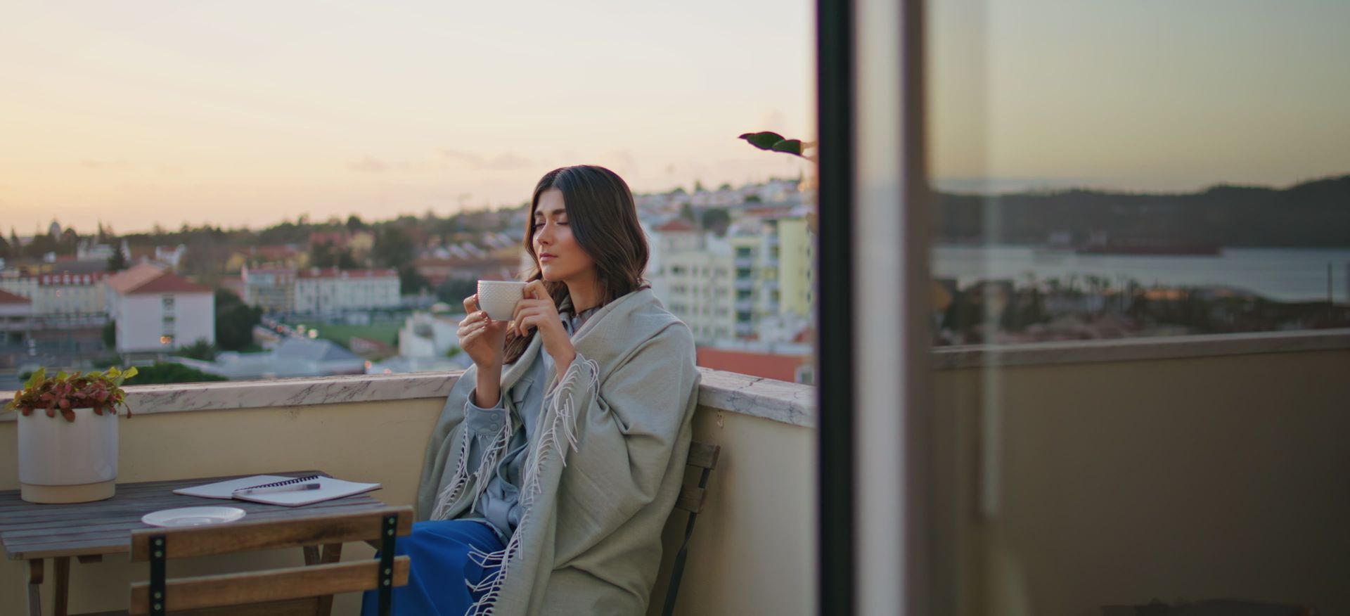 A sandy path leading to the ocean on a sunny day.