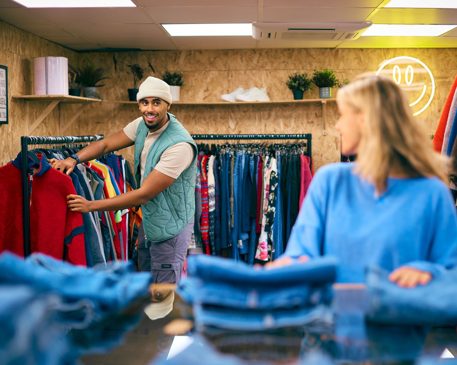 A sandy path leading to the ocean on a sunny day.