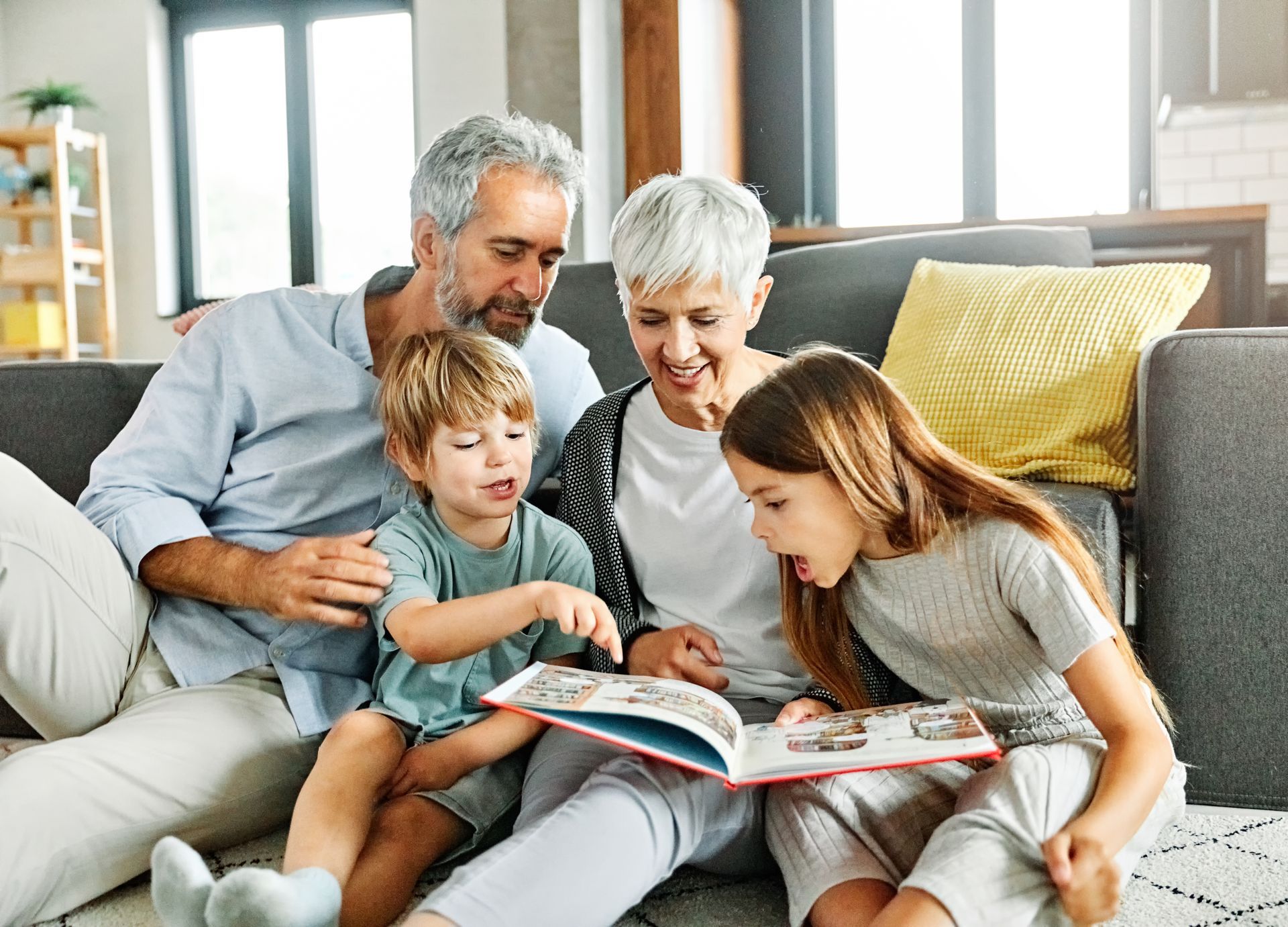 A sandy path leading to the ocean on a sunny day.