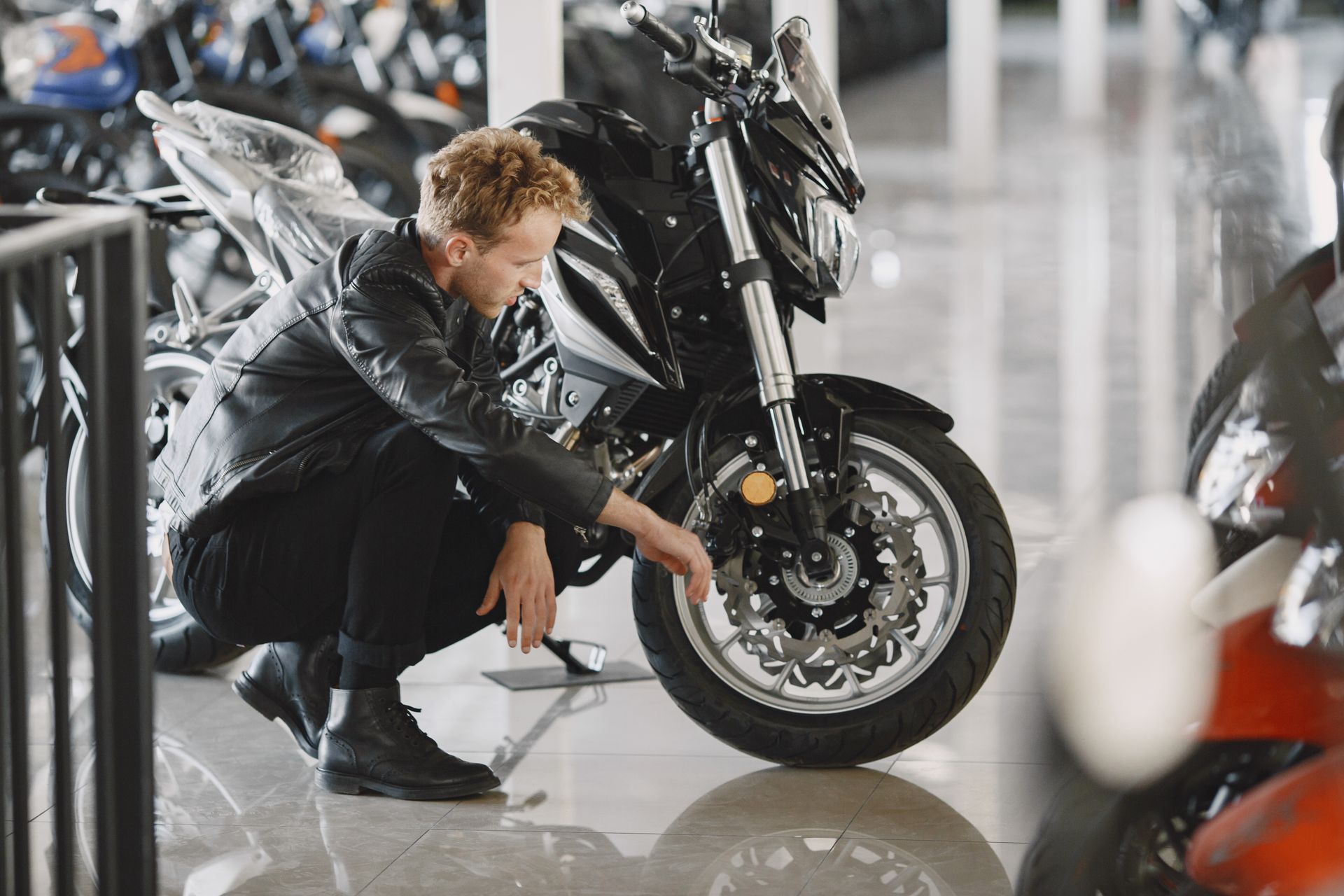 A sandy path leading to the ocean on a sunny day.