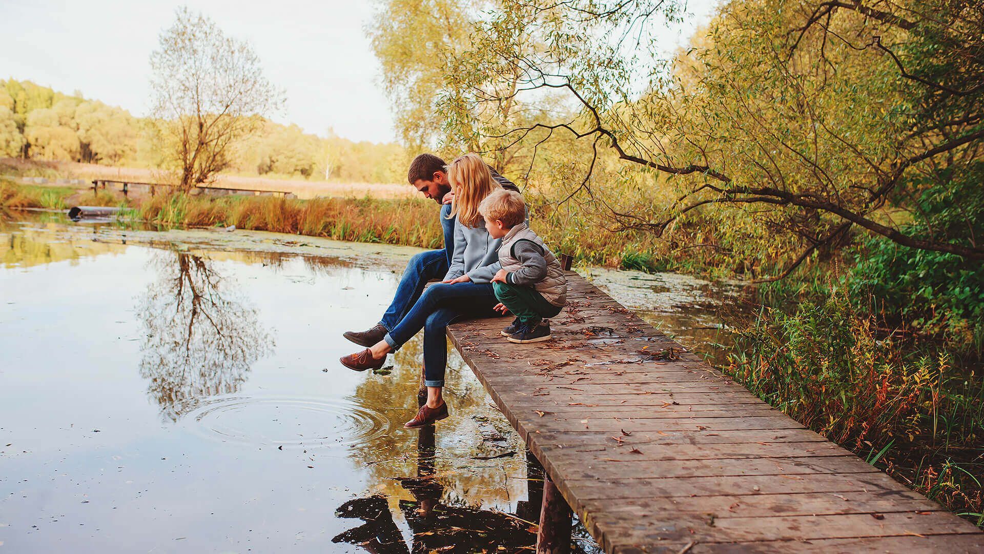 Family together outdoors on dock