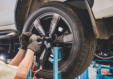 Mechanic is Changing the Tire — Federalsburg, MD — Danny's Auto Body