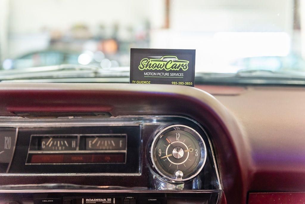 A close up of a car dashboard with a card that says show cars on it