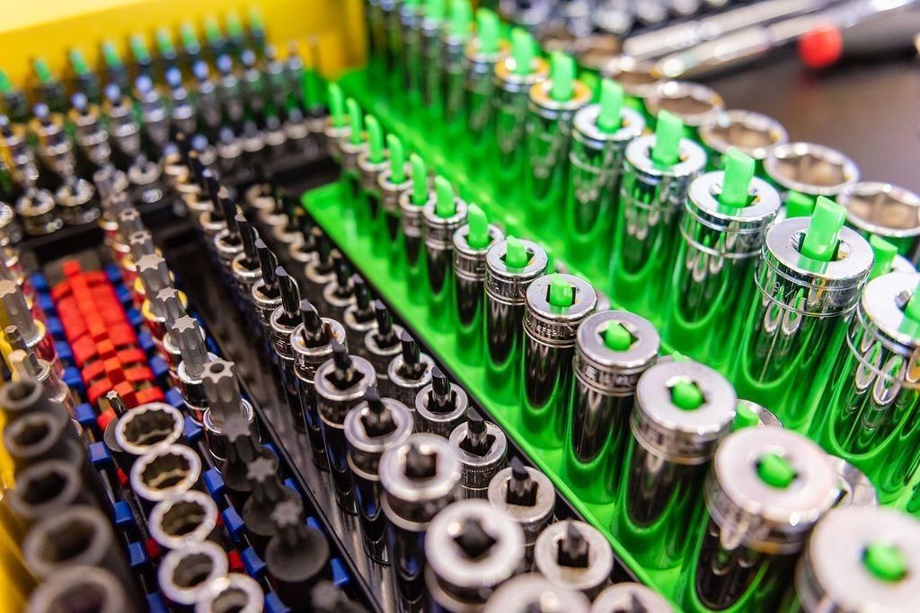 A box filled with a variety of sockets and bits.