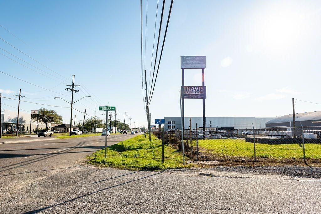 There is a large sign on the side of the road.