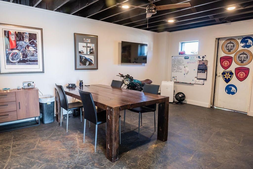 A room with a table and chairs in it