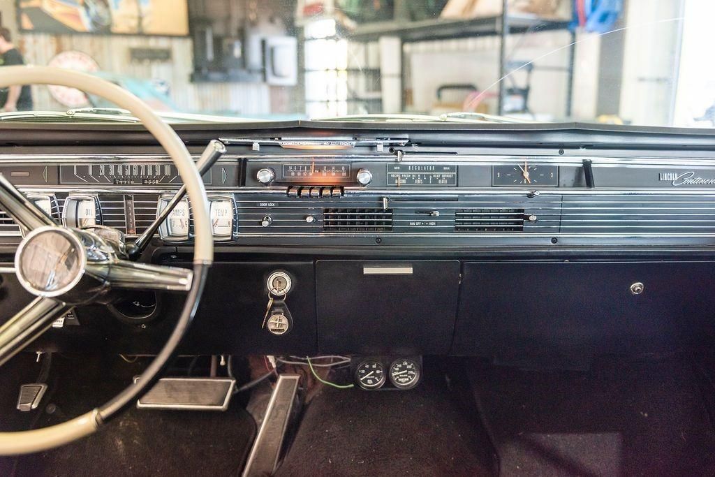 The interior of an old car with a steering wheel