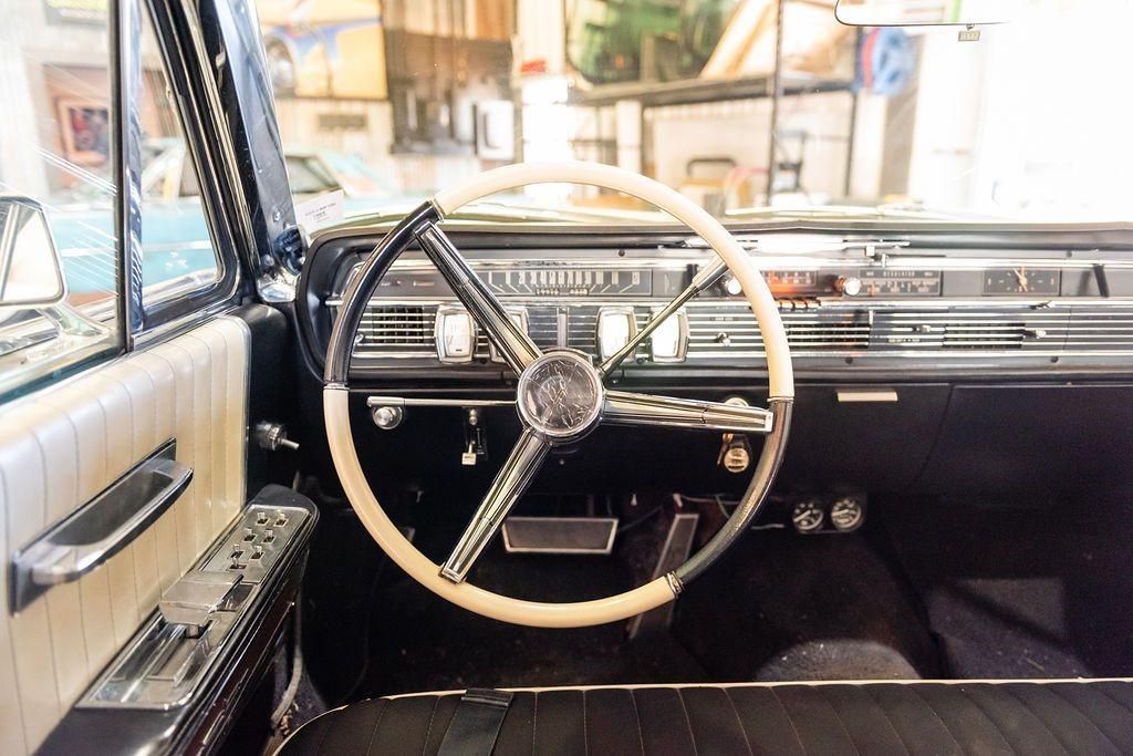 The interior of an old car with a steering wheel