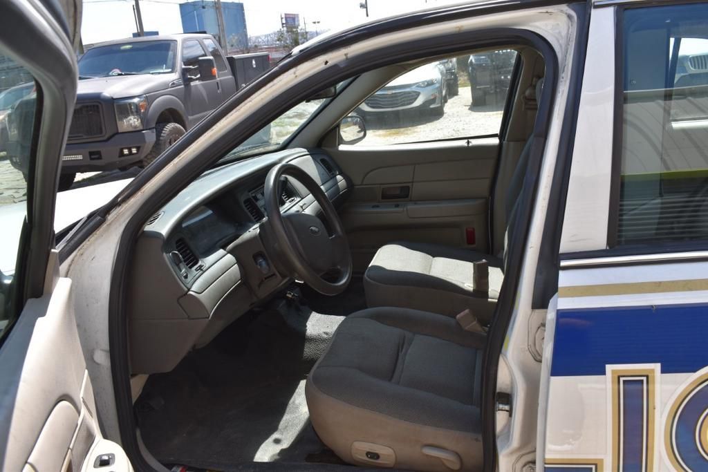 The inside of a police car with the door open
