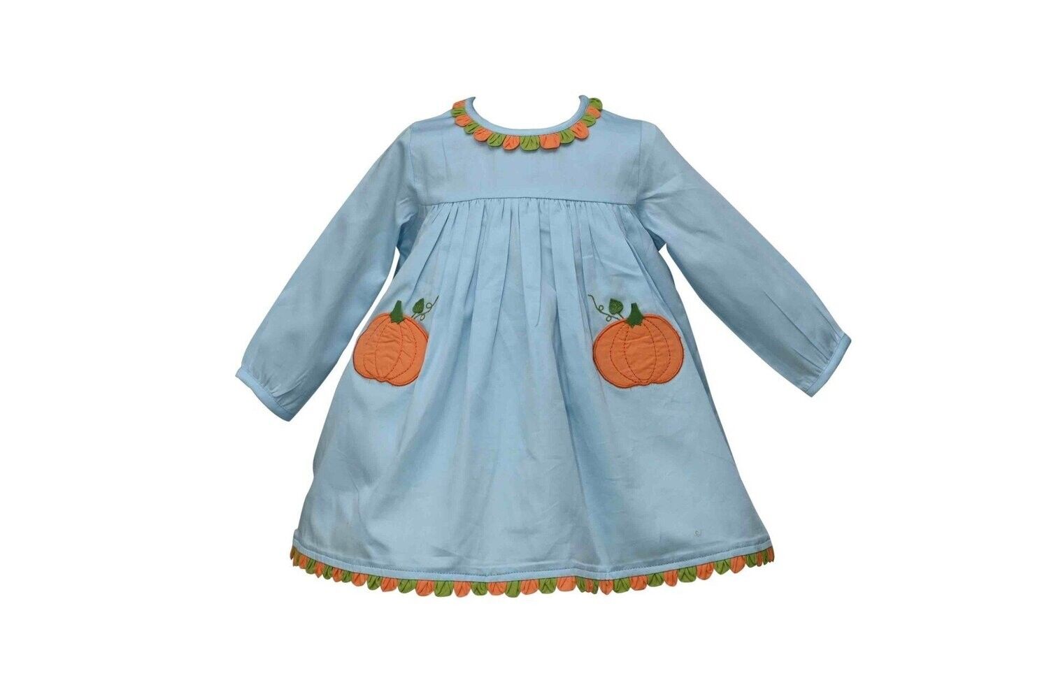 Light blue dress with orange pumpkin appliques on pockets, orange and green trim on neckline and hem.