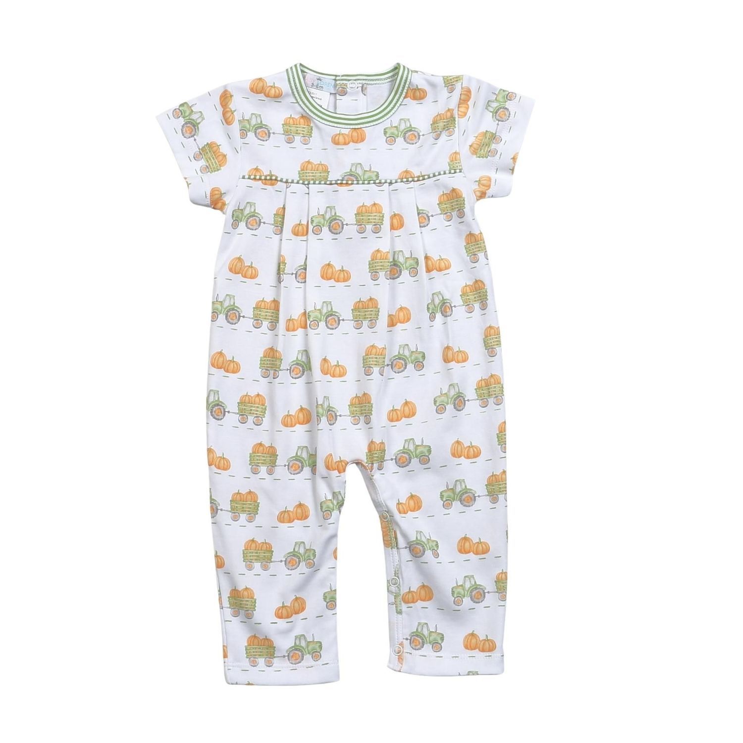 White baby jumpsuit with green and orange tractor print. It has a green trim on the neckline and sleeves.