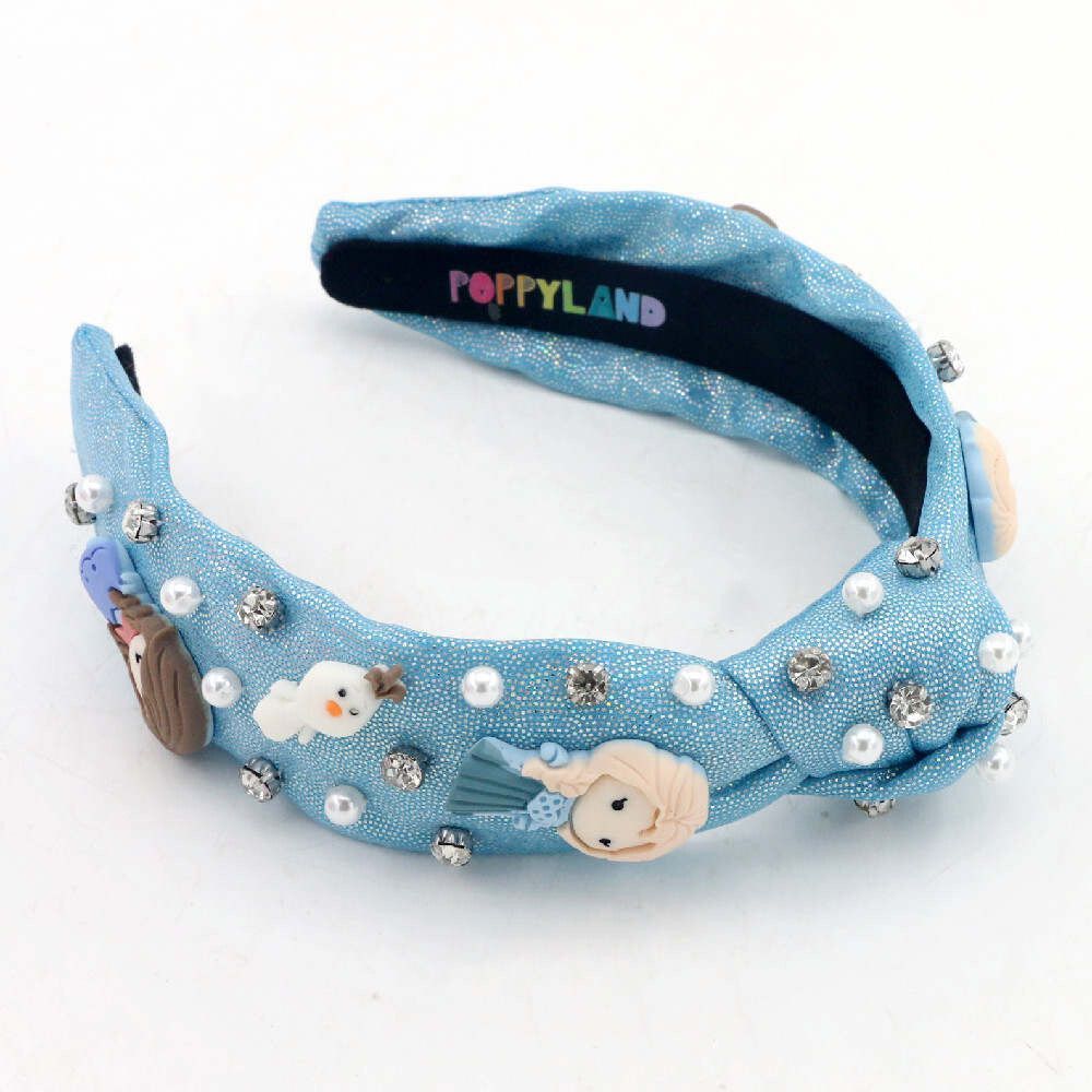 A blue headband with elsa and olaf on it
