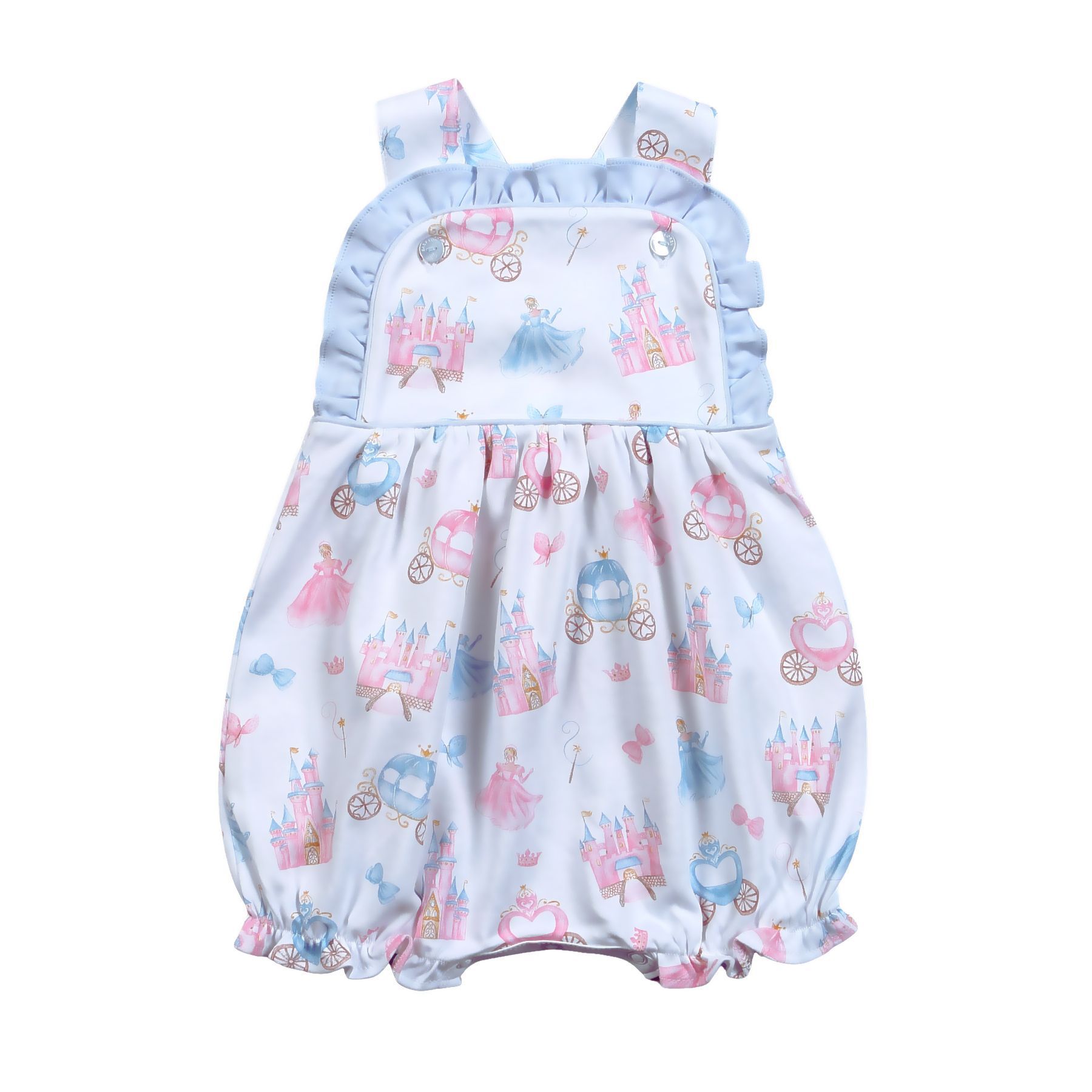 A baby girl is wearing a romper with a castle and carriage print.