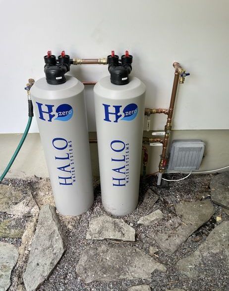 Two white cylinders with halo written on them
