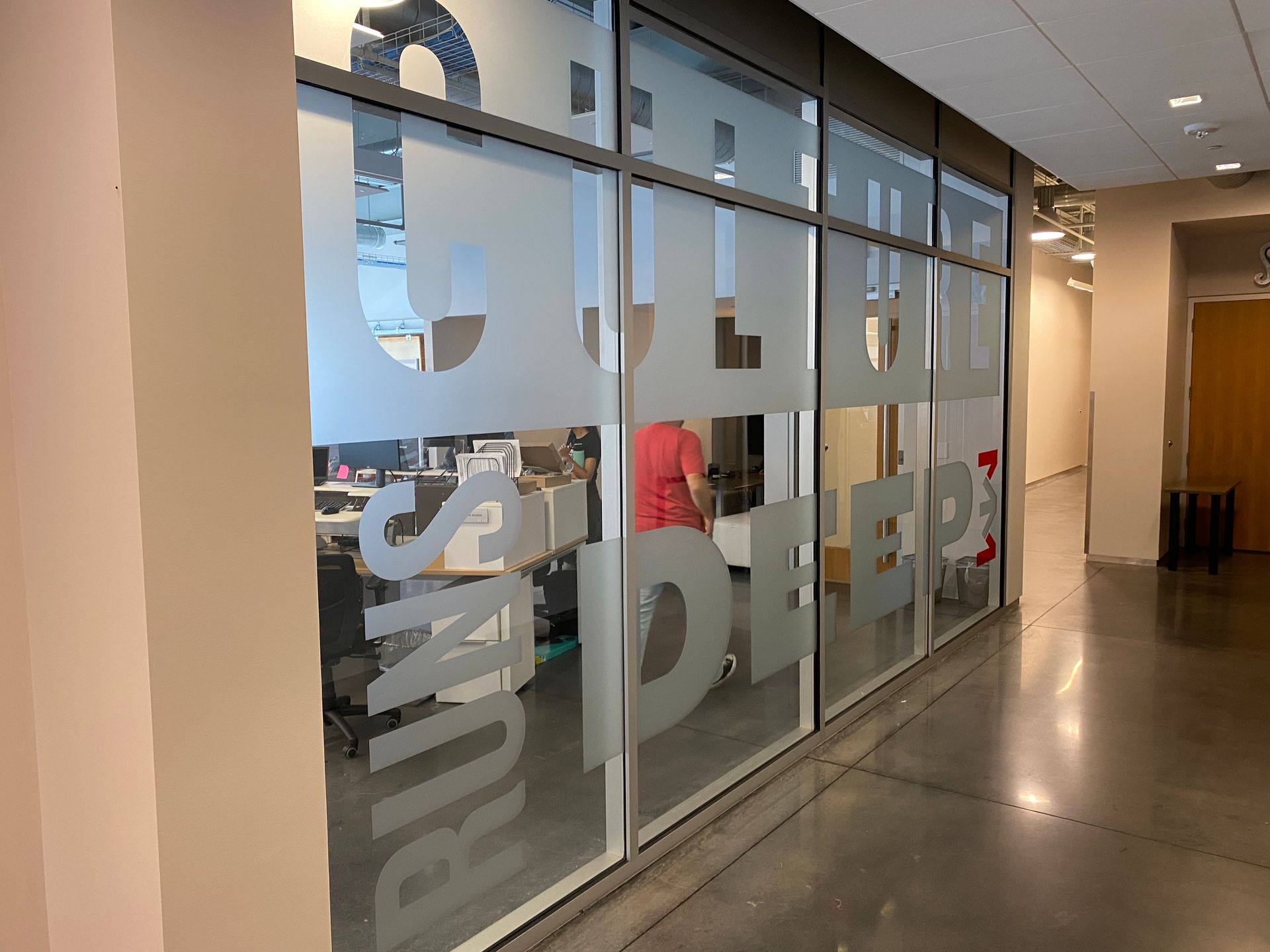 Glass wall with frosted lettering: 