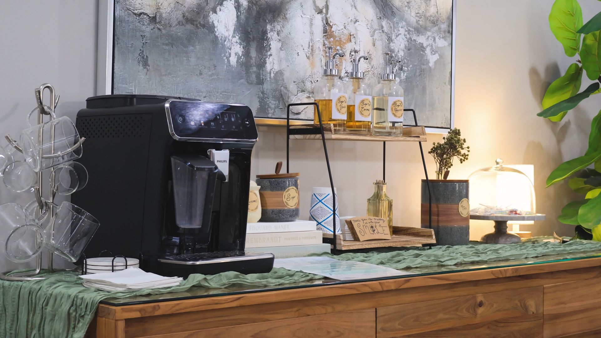 McMahon Dental's technician holding a metal tray with four gray, 3D-printed dental molds.