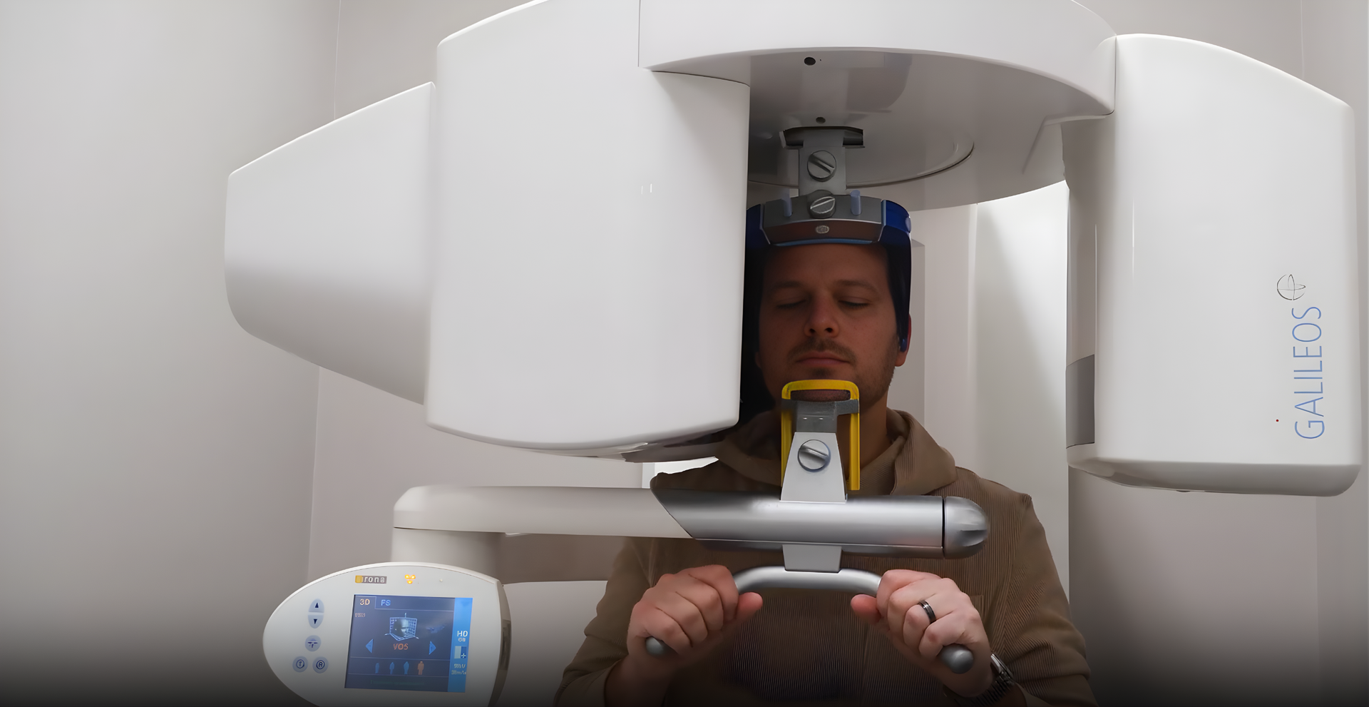 Man having a dental X-ray at McMahon Dental, wearing a protective apron.