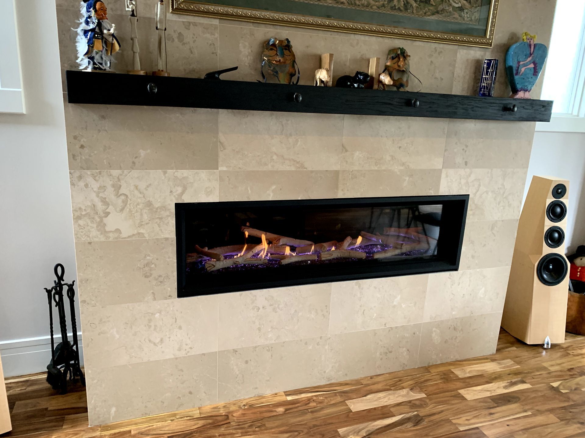 There is a fireplace in the middle of the room.