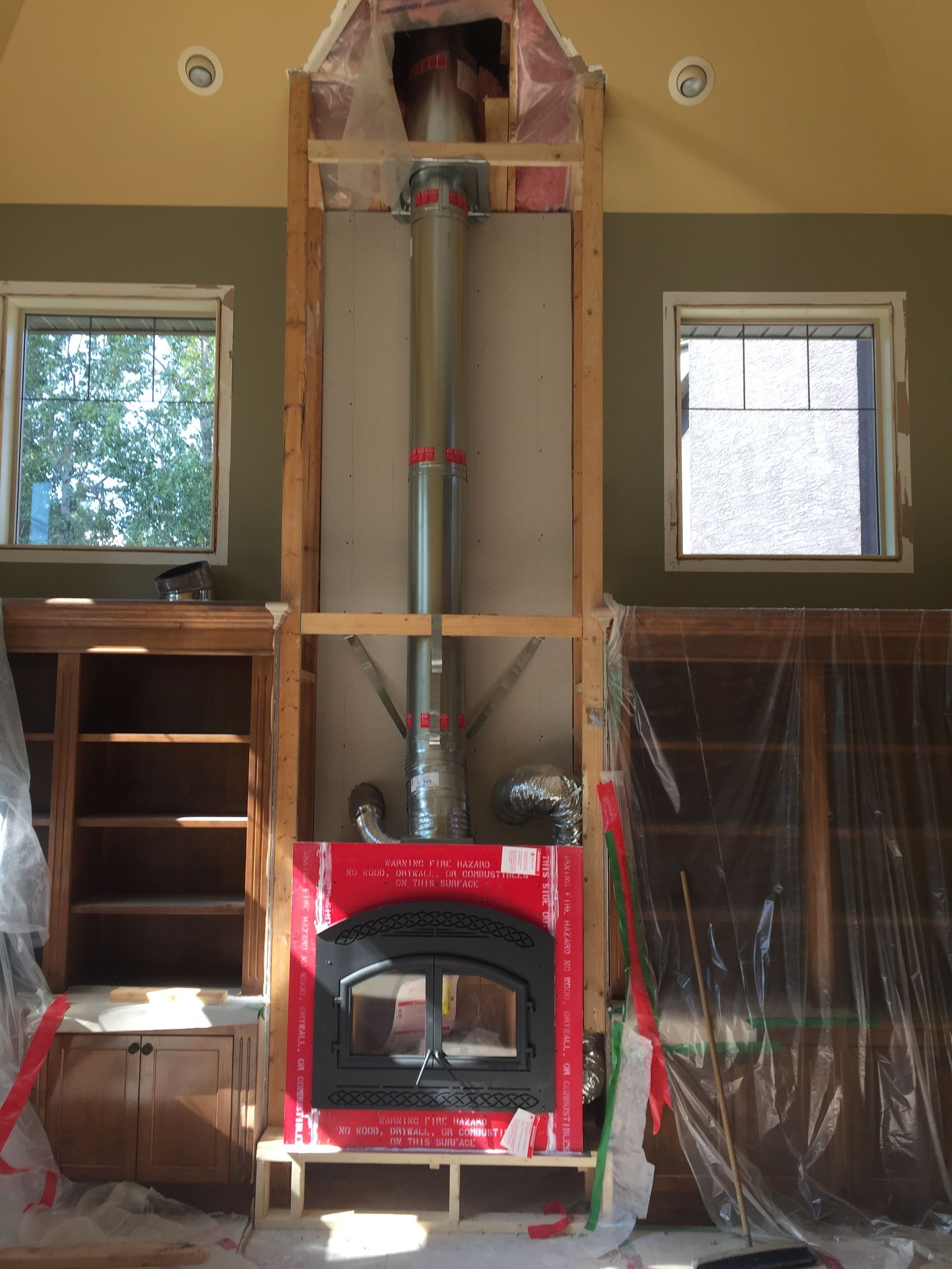 A fireplace is being built in a living room