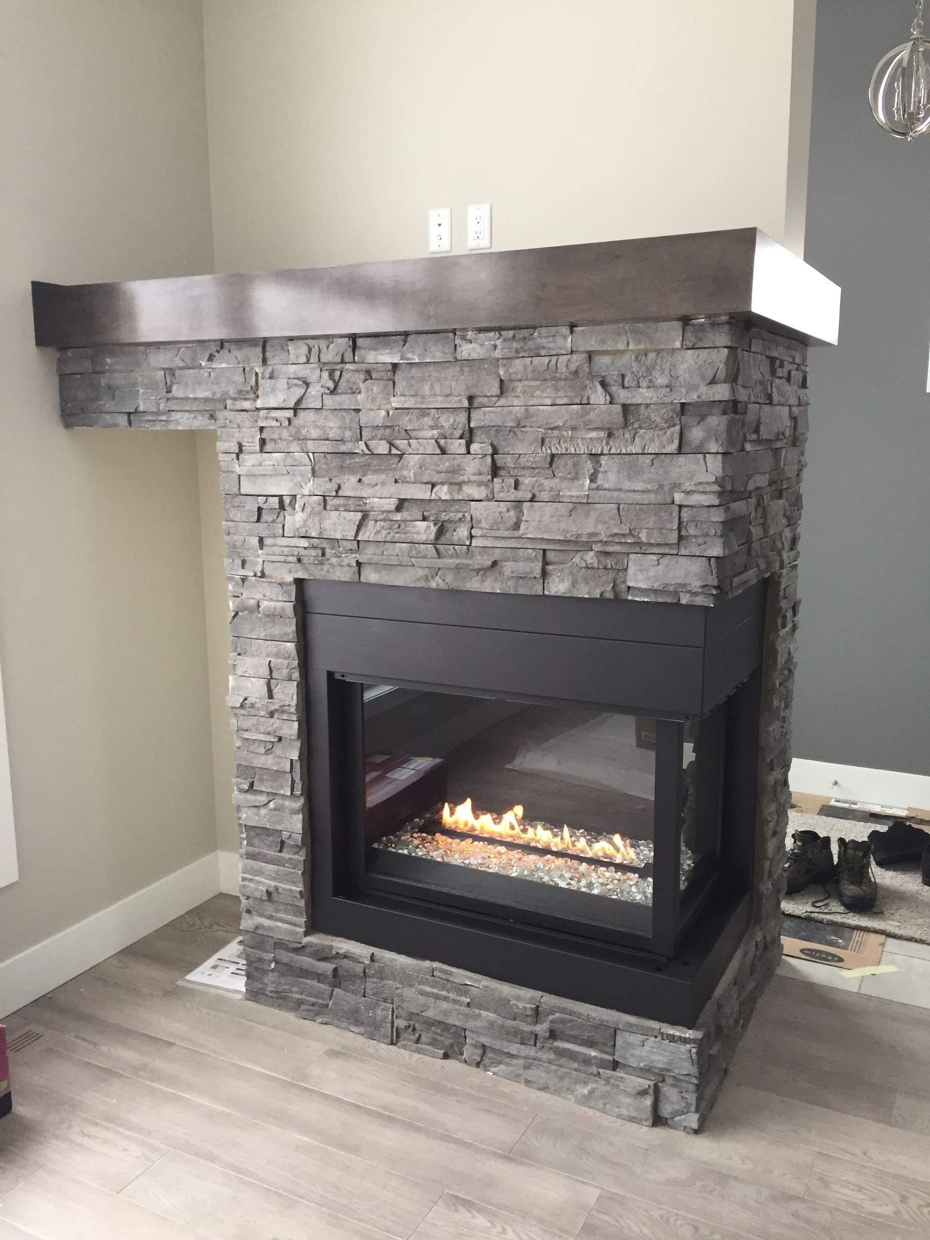 There is a fireplace in the middle of the room.