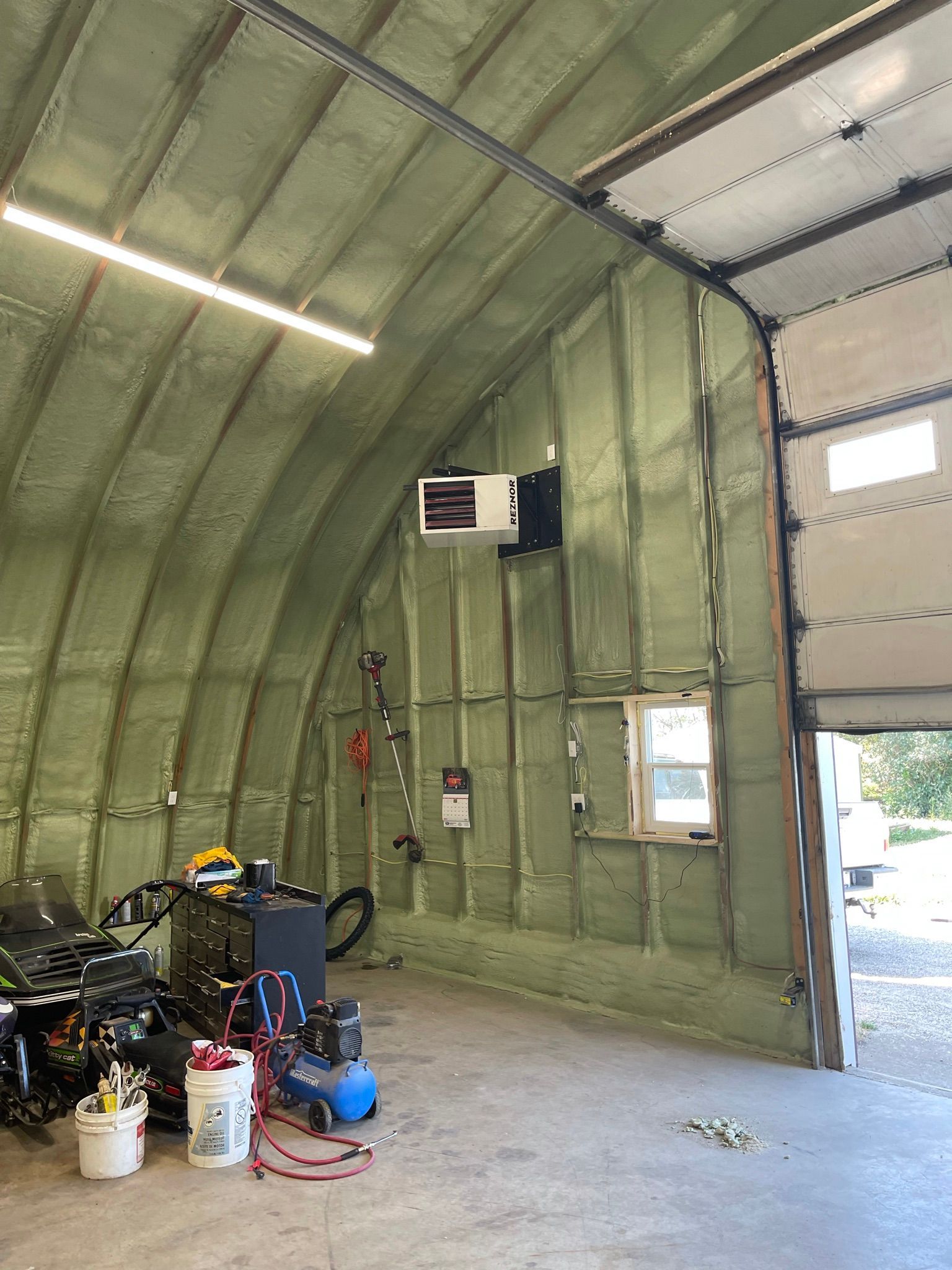 A garage filled with lots of tools and equipment.