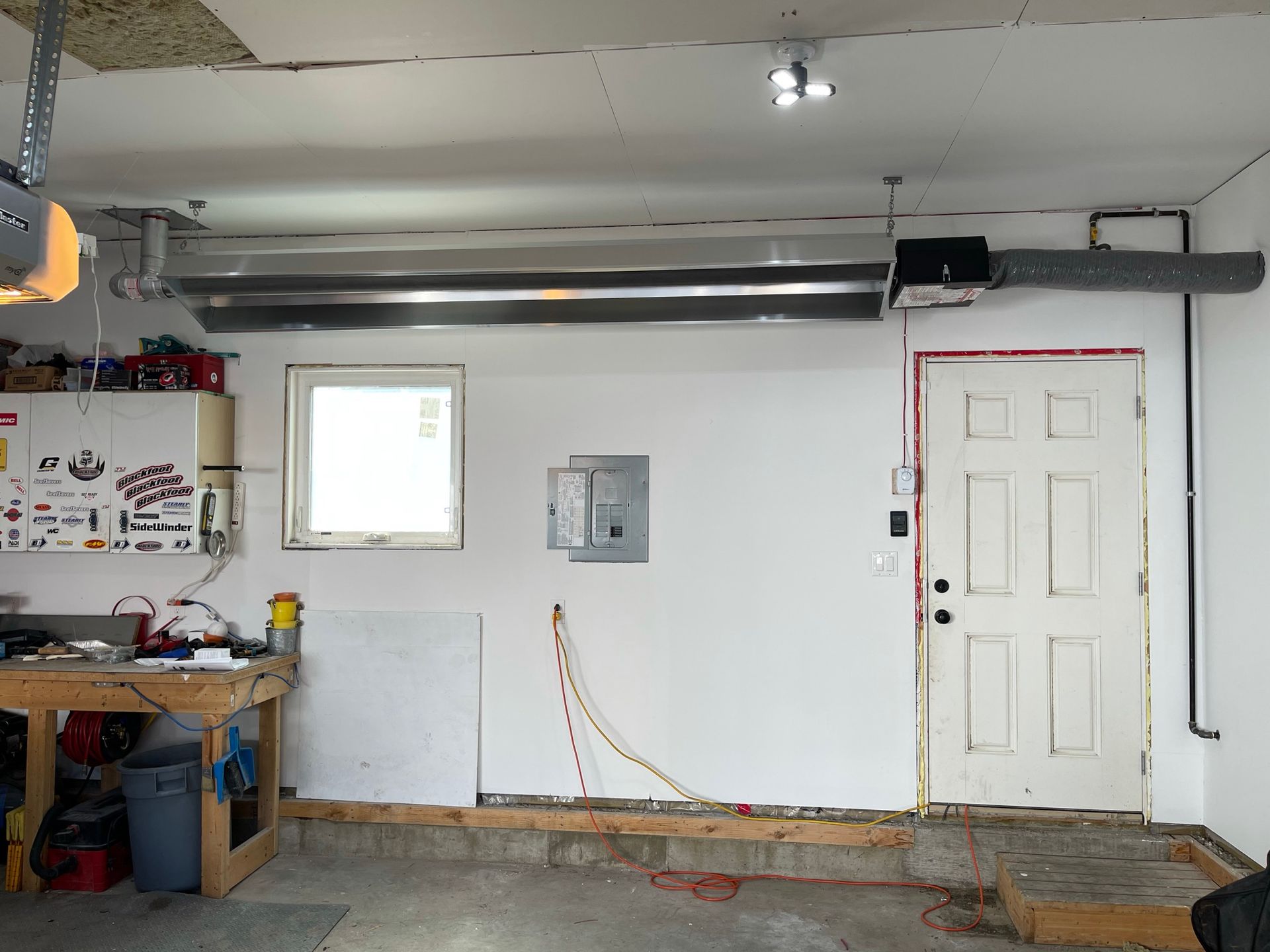 A garage with a white door and a window