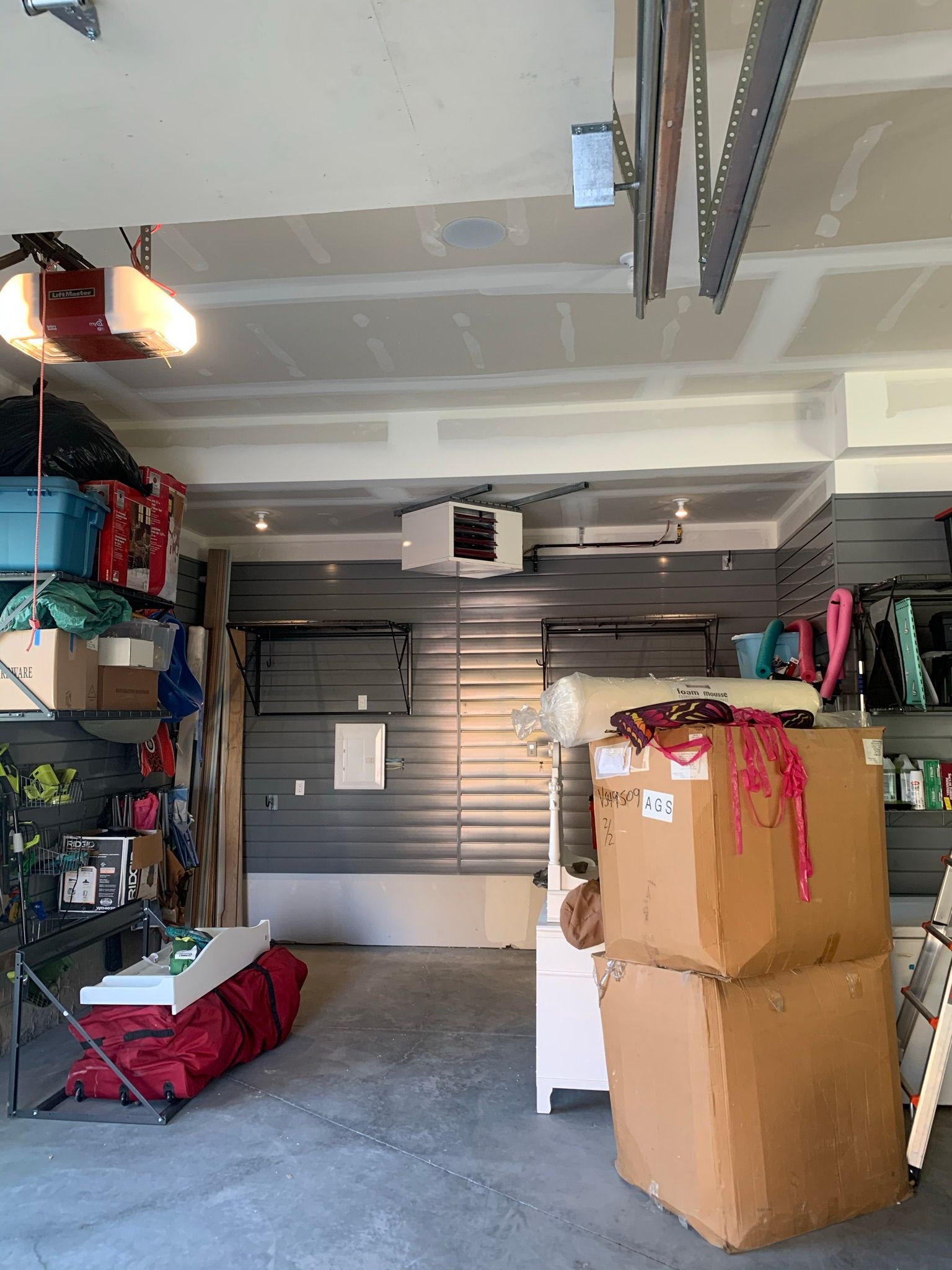 A garage filled with lots of boxes and a table.