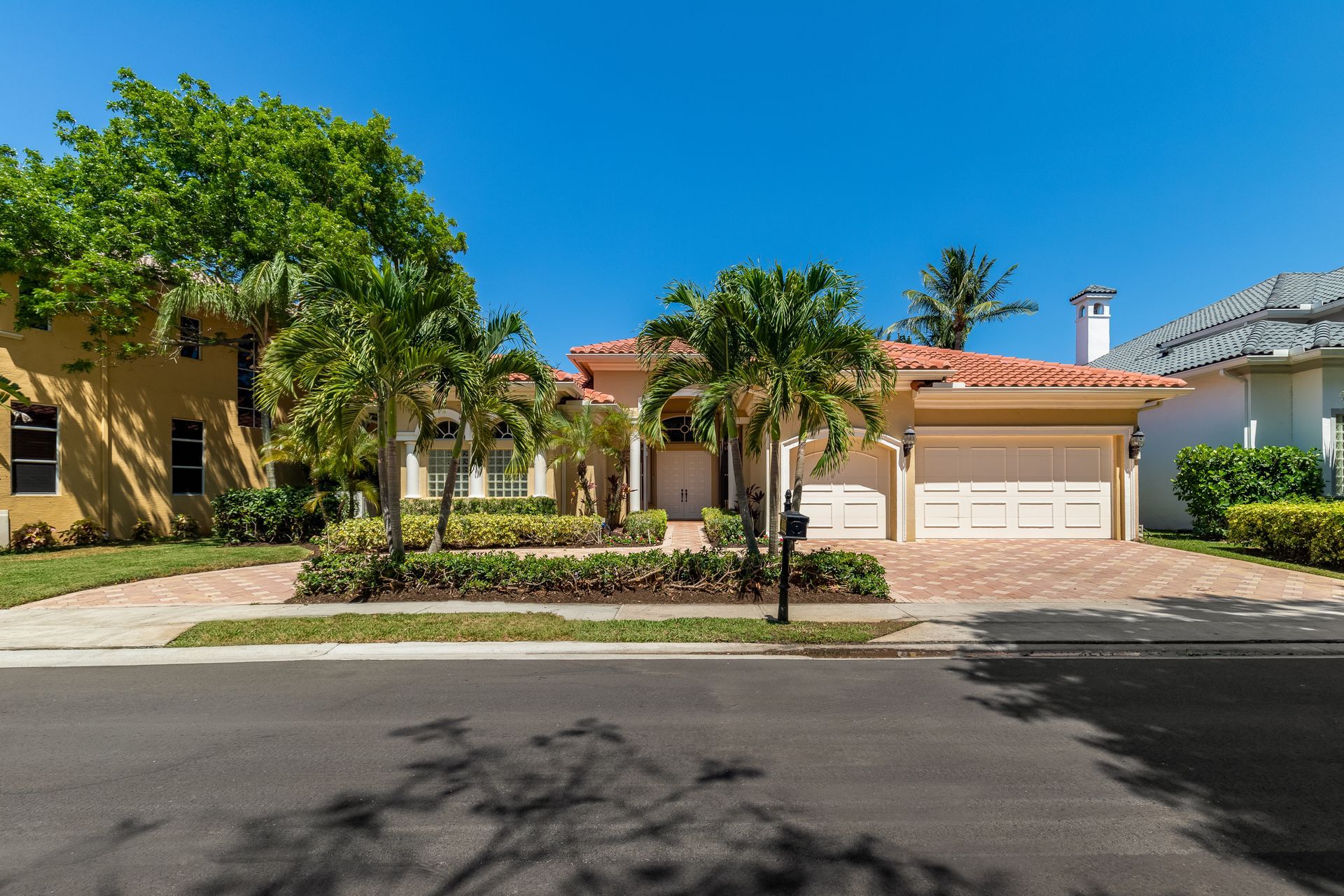 A house with a garage and a driveway in front of it