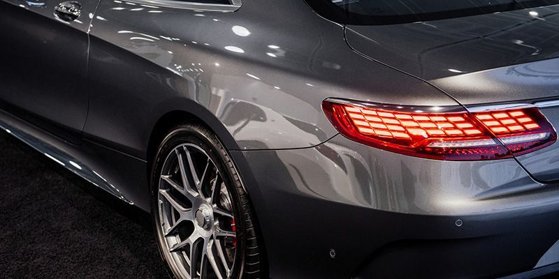 A close up of the rear end of a mercedes benz s63 amg coupe.