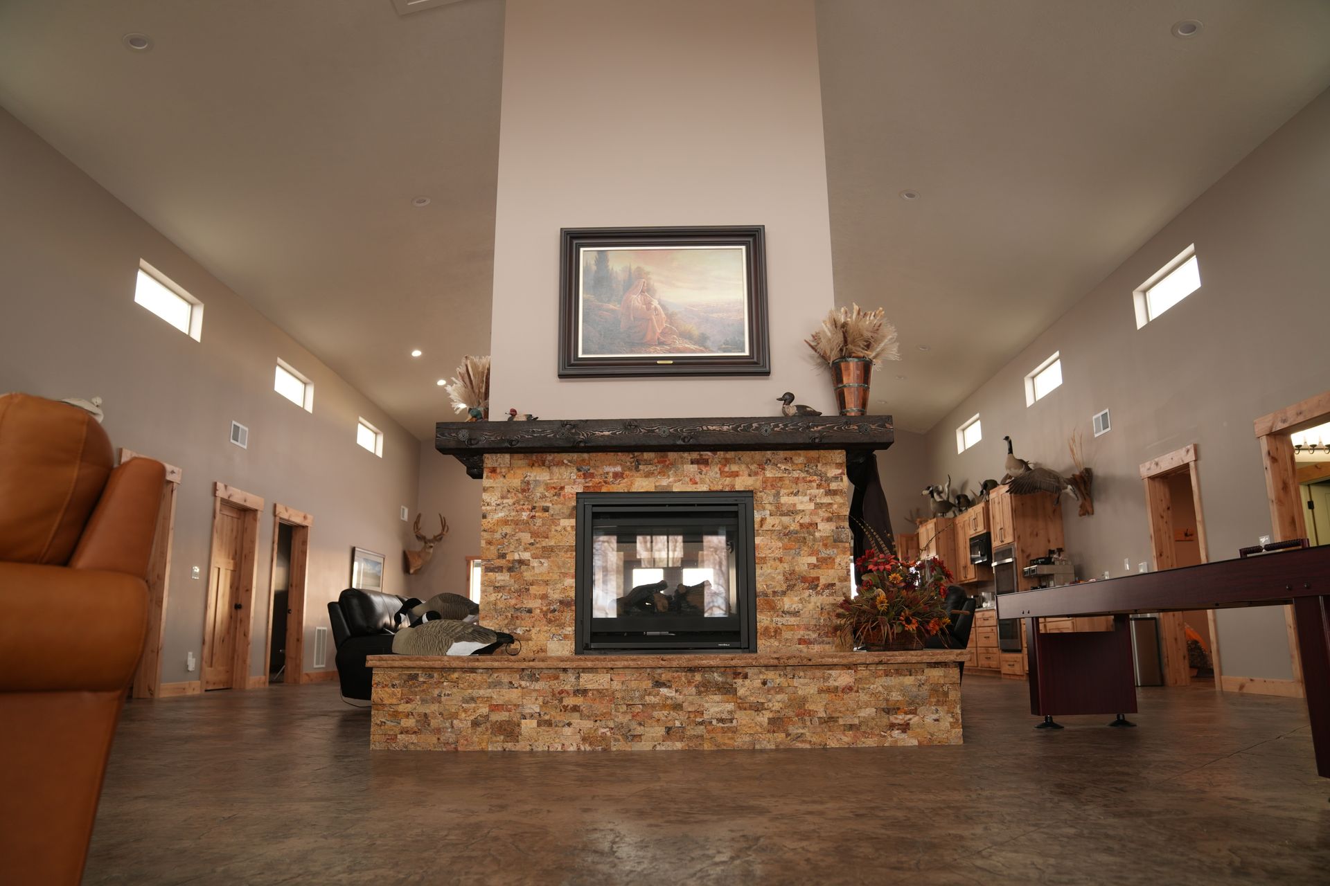 There is a fireplace in the middle of the room.